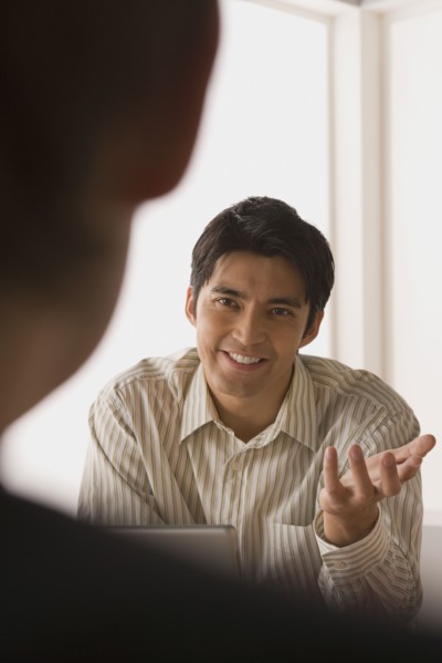 Two businessmen in meeting. Photo : Rob Lewine
