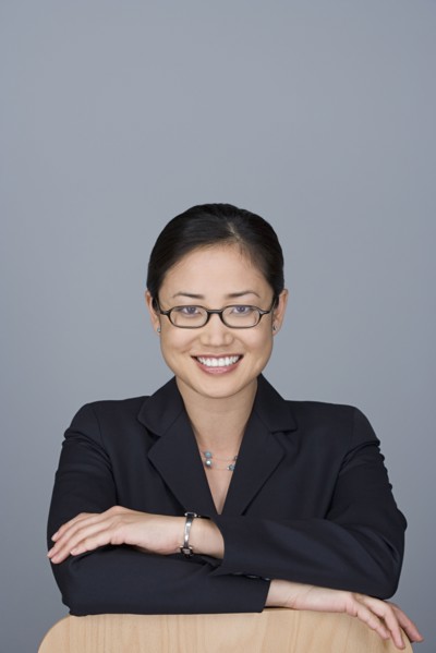 Portrait of happy young businesswoman. Photo: Rob Lewine