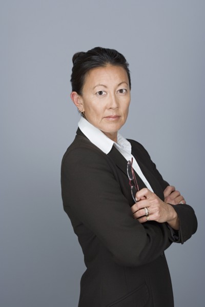 Portrait of happy mature businesswoman. Photo : Rob Lewine