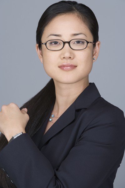 Portrait of cheerful businesswoman. Photo: Rob Lewine