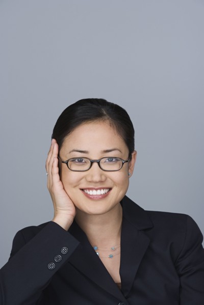 Portrait of happy young businesswoman. Photo: Rob Lewine
