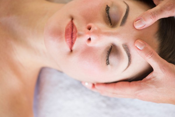 Woman receiving face massage.