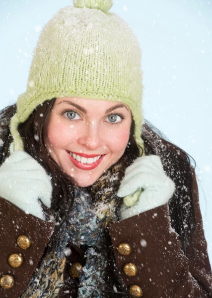 Studio portrait of woman in winter clothing.