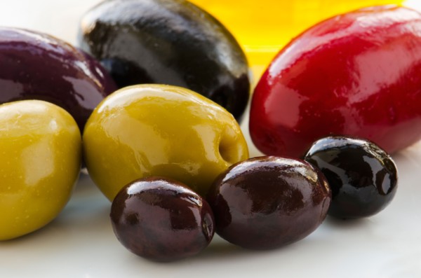 Close-up of various olives, studio shot.