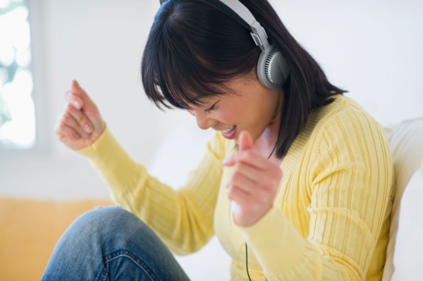 Smiling woman listening music.