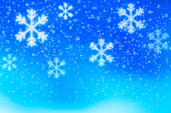 Snowflakes on blue background, studio shot.