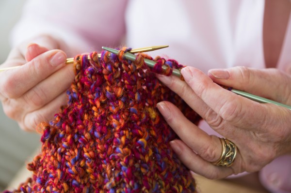 Senior woman knitting, close-up.
