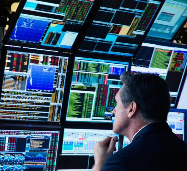 Stock trader working on computer.