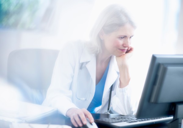 Senior female doctor working in her office.