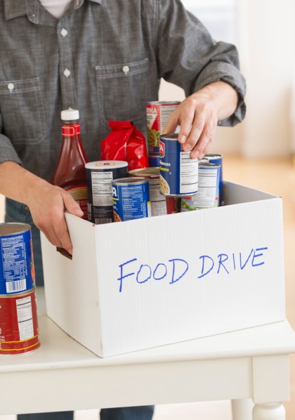 Man packing food for donation.