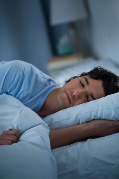 Man sleeping in bed.