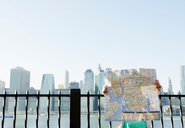 USA, New York State, New York City, Brooklyn, Woman holding map. Photo : Jamie Grill