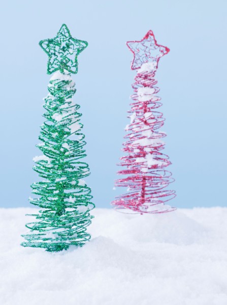 Studio shot of artificial Christmas trees. Photo : Daniel Grill