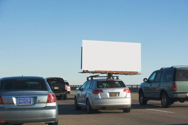 Traffic and blank billboard. Photo : fotog