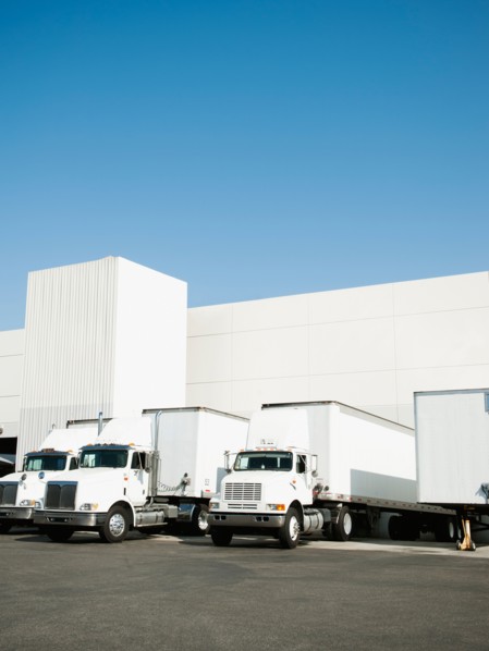 Trucks and warehouse.