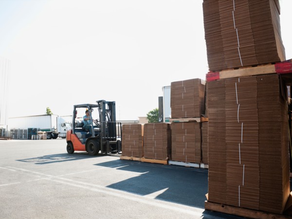 Forklift truck moving pallets.