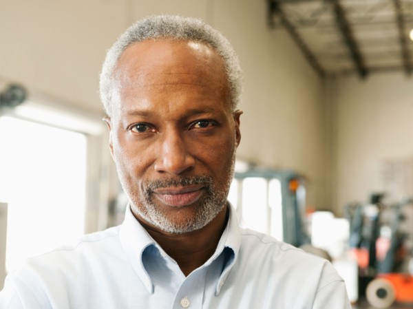 Portrait of businessman in warehouse.