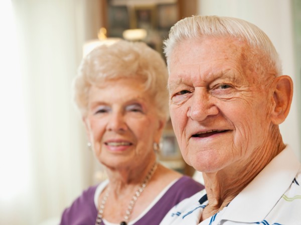 Portrait of senior couple smiling.