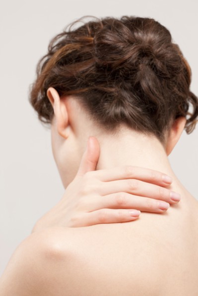 Rear view of beautiful young woman, studio shot. Photo : Jan Scherders