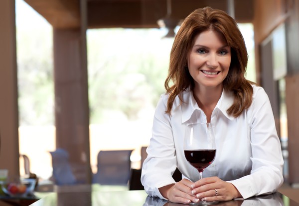 Portrait of woman with glass of wine. Photo : db2stock