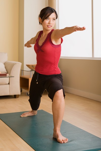 Woman in yoga pose. Photo : Rob Lewine