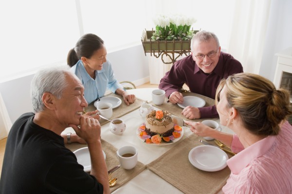 Two couples having coffee with cake. Photo : Rob Lewine