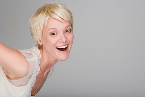 Studio portrait of playful young woman. Photo : Rob Lewine