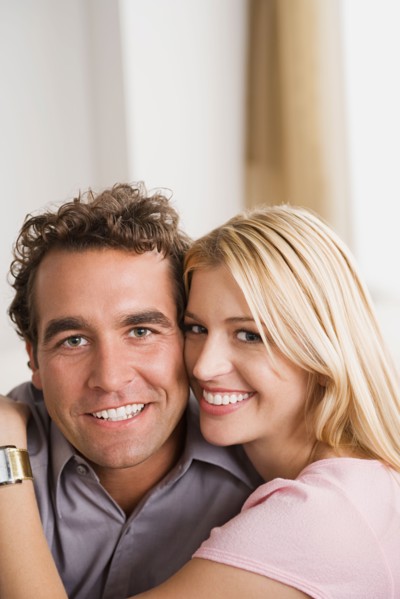 Portrait of smiling couple. Photo : Rob Lewine