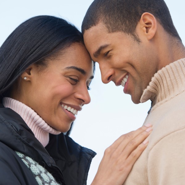 Portrait of couple embracing.
