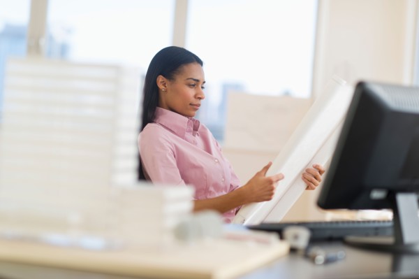 Female architect in office.