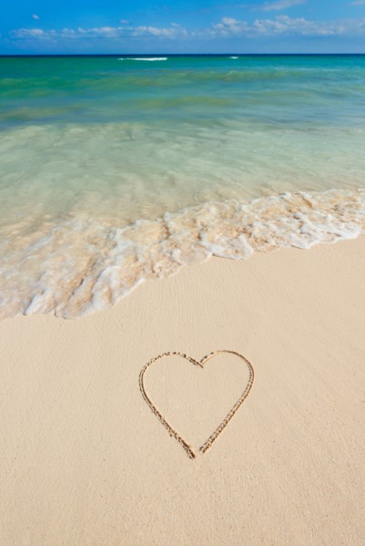 Mexico, Yucatan. Heart drawing in sand on beach.