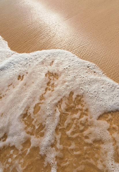 Mexico, Yucatan. Sea waves on beach sand.