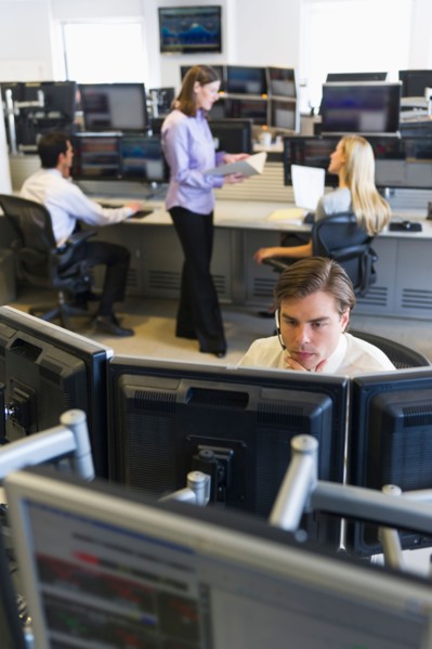 Traders at trading desk.