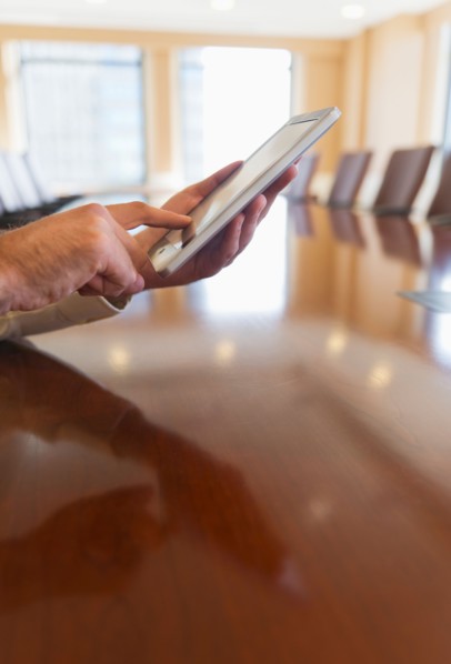 Hands of businessman using tablet pc.