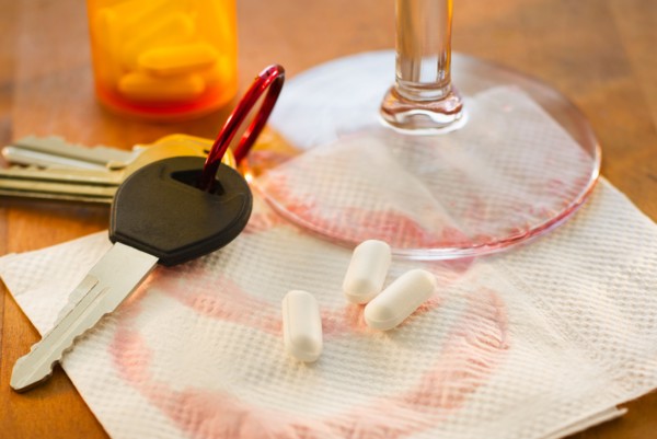 Car keys, pills and alcohol, studio shot.
