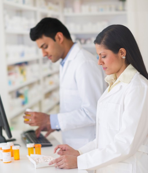 Two pharmacists in pharmacy.