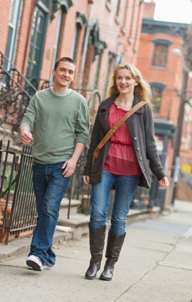 Couple walking on street.