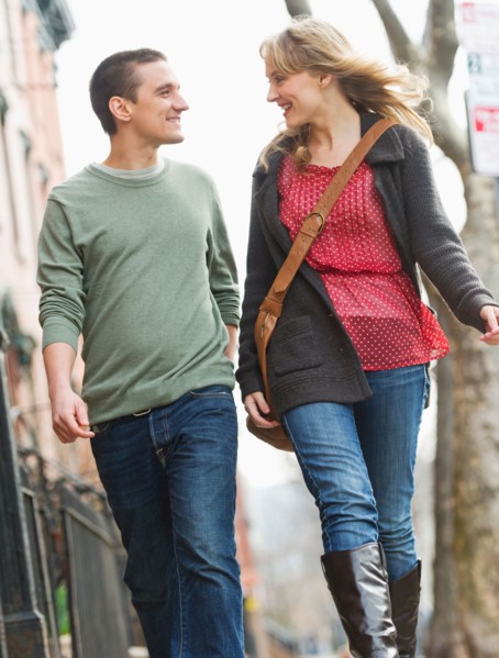 Couple walking on street.