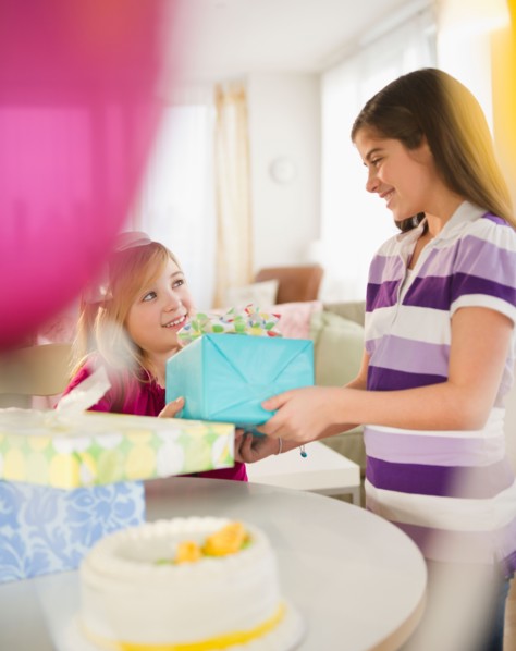 Two girls celebrating birthday. Photo : Jamie Grill