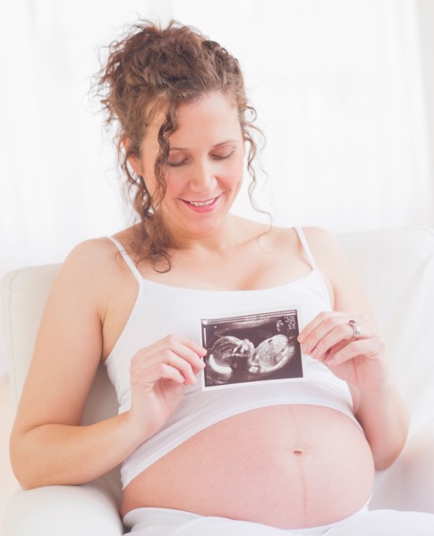 Pregnant woman with ultrasonography scan. Photo : Daniel Grill