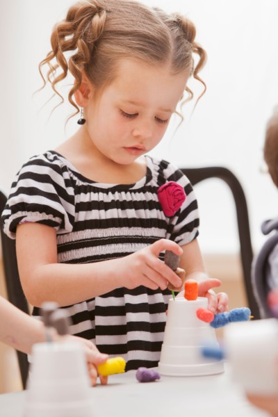 Girl (2-3) playing in kindergarten. Photo : Mike Kemp