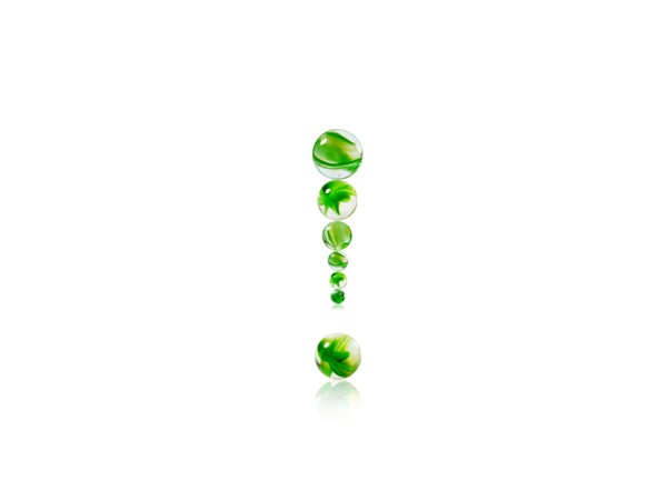 Studio shot of green marbles arranged in Exclamation Point. Photo : David Arky