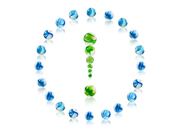 Studio shot of green marbles arranged in Exclamation Point. Photo : David Arky