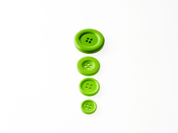 Studio shot of green buttons in a row. Photo : David Arky