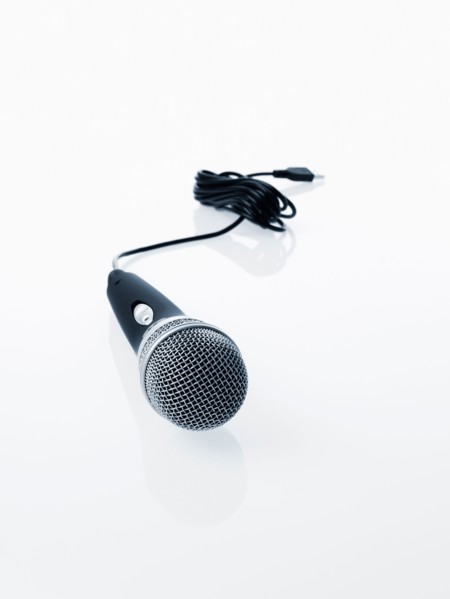 Studio shot of microphone and microphone cable on white background. Photo : David Arky