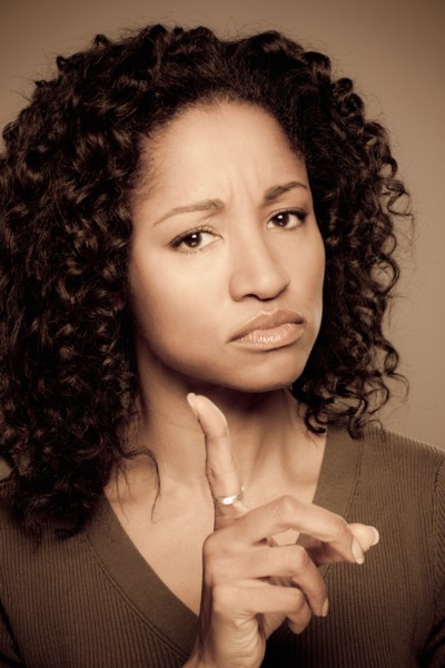 Studio shot of displeased mid adult woman. Photo : Rob Lewine
