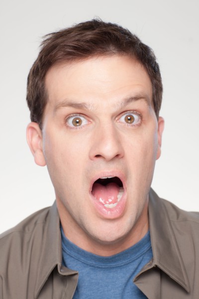 Studio shot of shocked mid adult man. Photo : Rob Lewine