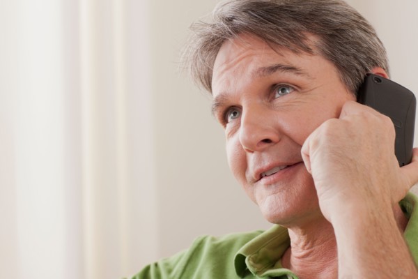 Man talking on phone. Photo : Rob Lewine