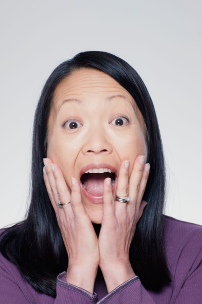 Studio portrait of mature woman screaming. Photo : Rob Lewine