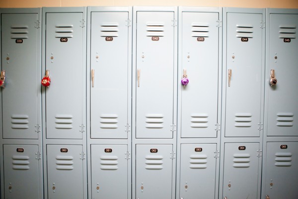 Row of lockers with different padlocks. Photo : Jessica Peterson